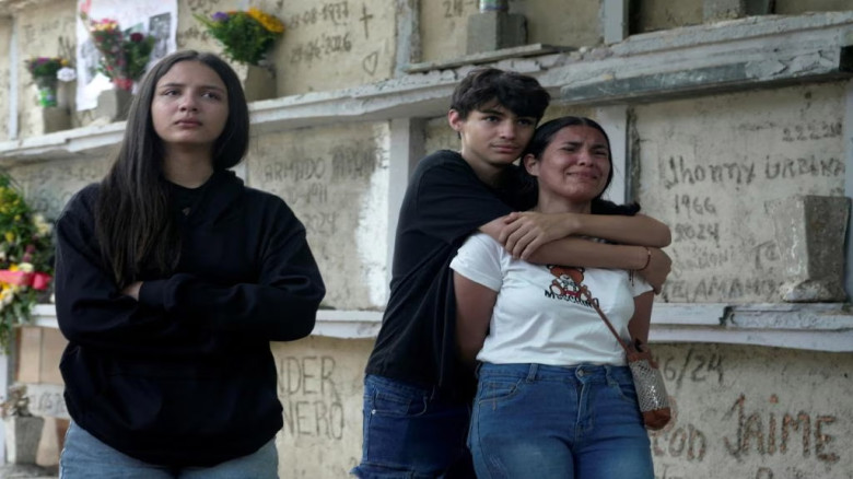 Key Venezuela port opens with US aid, as burials begin